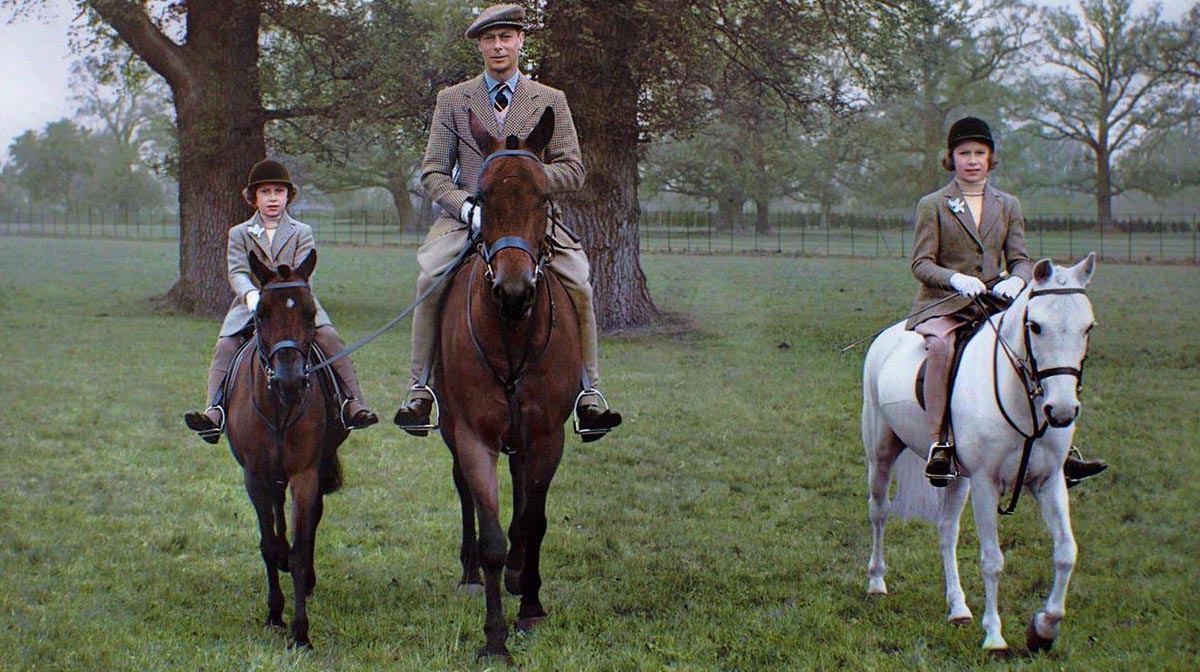King George VI riding with his daughters Princess Elizabeth (later Queen Elizabeth II) and Princess Margaret