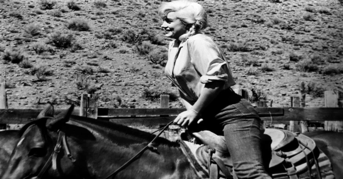 Marilyn Monroe riding a horse during the filming of The Misfits