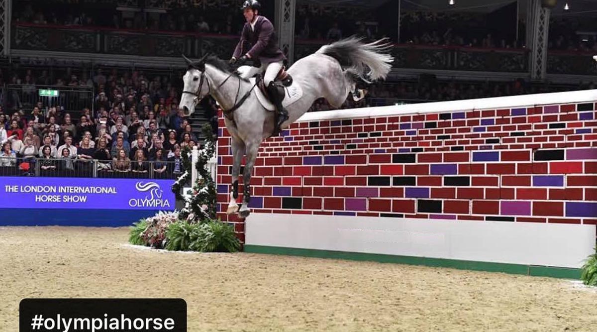 Guy Williams and Mr Blue Sky UK Win 2021 Puissance At London International Horse Show