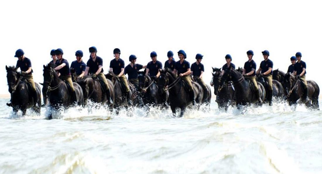 The horses of the household cavalry riding on the beach